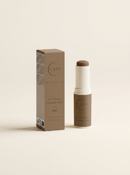 Luxury skincare campaign photography. Noyra CC Cream Ceramide Stick SPF30 Deep placed on warm natural stone surface under Mediterranean sunlight. Minimal luxury styling. Soft shadows. Elegant neutral architecture in background. Premium beauty editorial aesthetic. High-end cosmetic advertising photography. Accurate product colors and packaging. No text overlays. No branding artifacts.