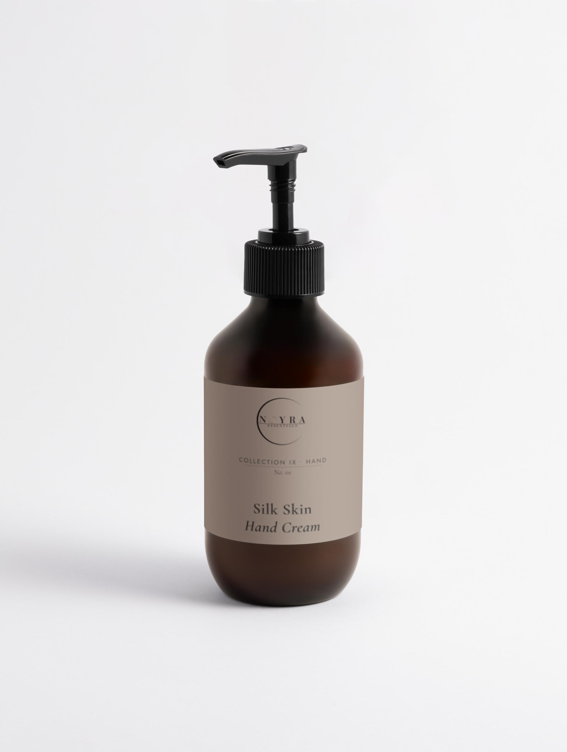 Nourishing hand cream with sandalwood scent in amber pump 