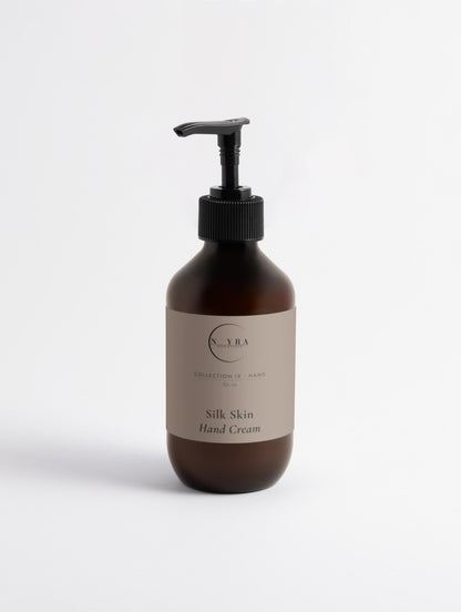 Nourishing hand cream with sandalwood scent in amber pump 